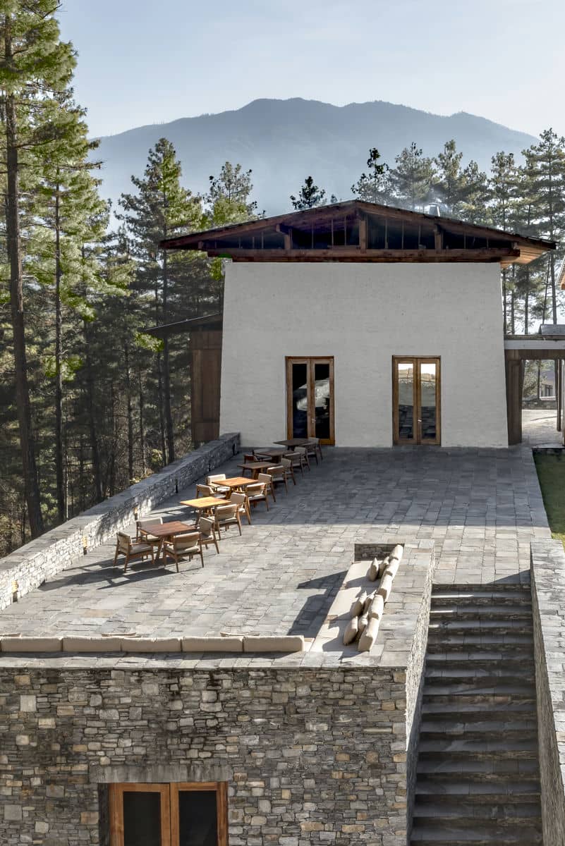 Amankora, Bhutan - Outdoor Terrace with view of Living Room beyond and Library